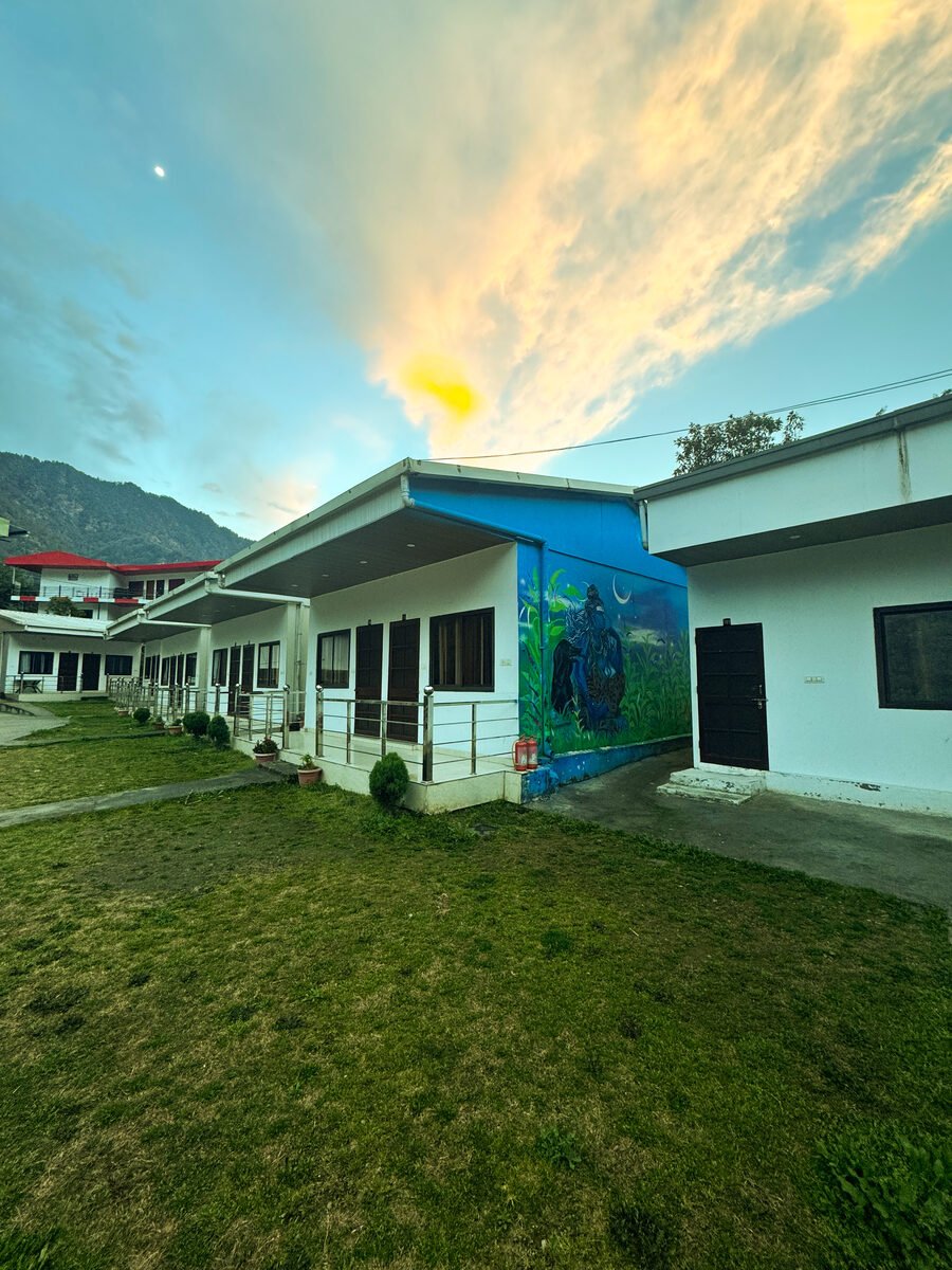 Shersi Heights Resort building with mountain backdrop